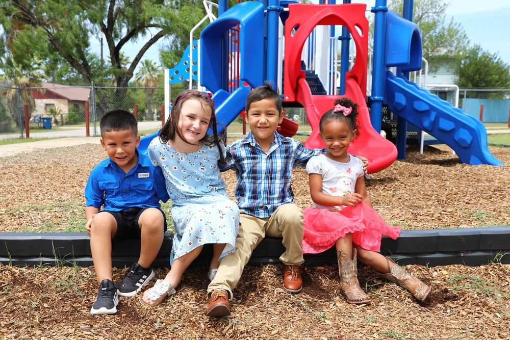 Children sitting at playground