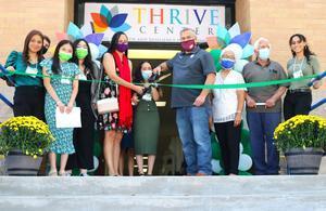 Thrive Center - students and superintendent cutting ribbon